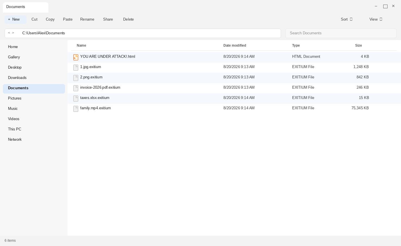 Encrypted files after Exitium. The .exitium names and YOU ARE UNDER ATTACK!.html are the tell.