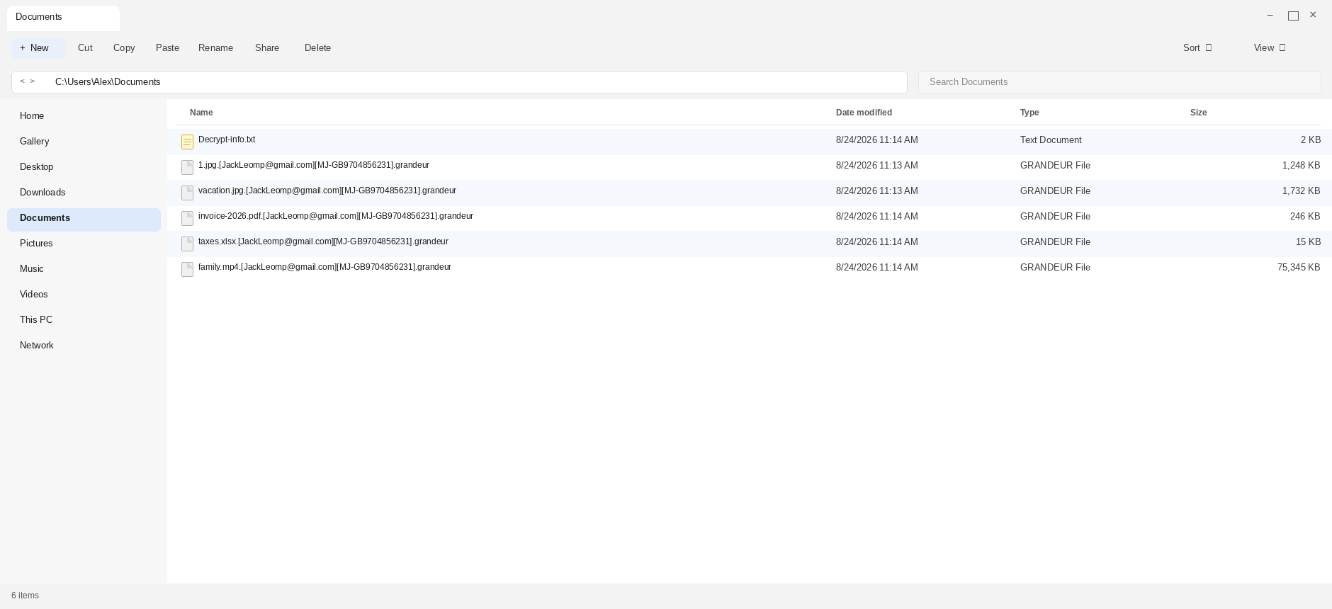 Encrypted files after Grandeur. The .grandeur names and Decrypt-info.txt are the tell.