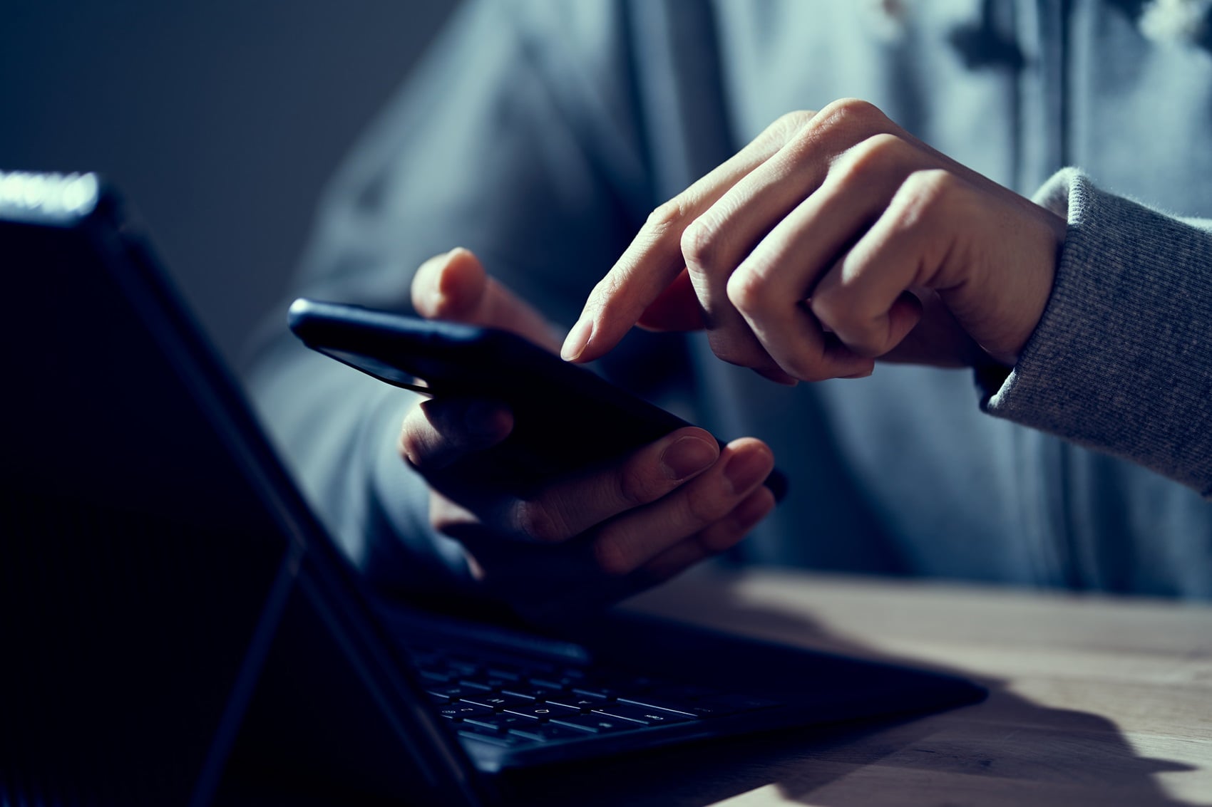 Person reading an unexpected Microsoft Teams guest invitation on a phone