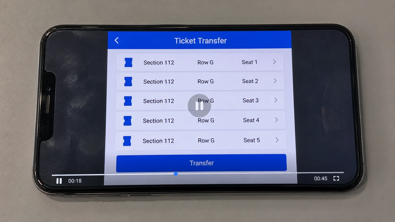 Phone screen showing a paused recording of five tickets on a transfer page