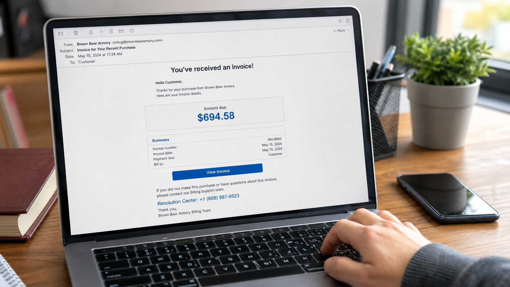 Realistic Brown Bear Armory PayPal scam invoice showing a $694.58 charge and fake support number