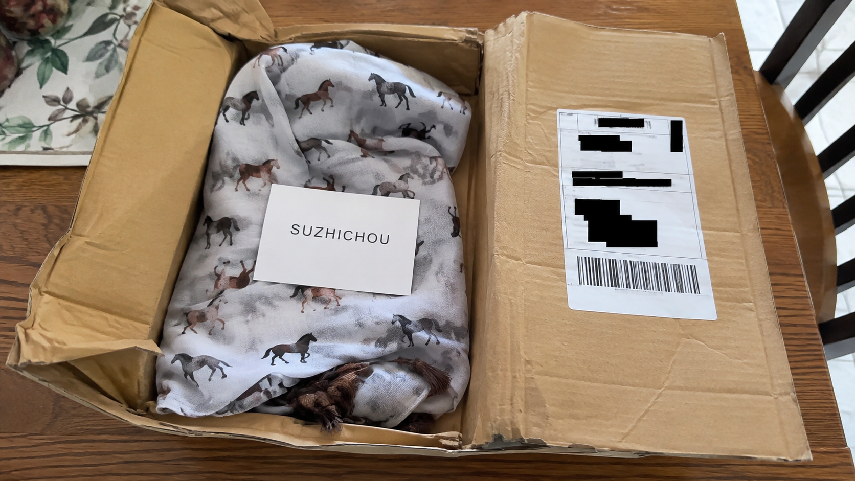 Unordered horse scarf delivered in a parcel labeled SUZHICHOU